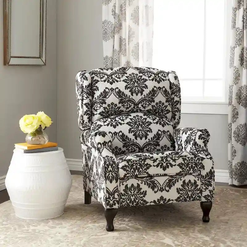 Poltrona reclinabile a spinta con schienale ad ali imbottita e borchie decorative