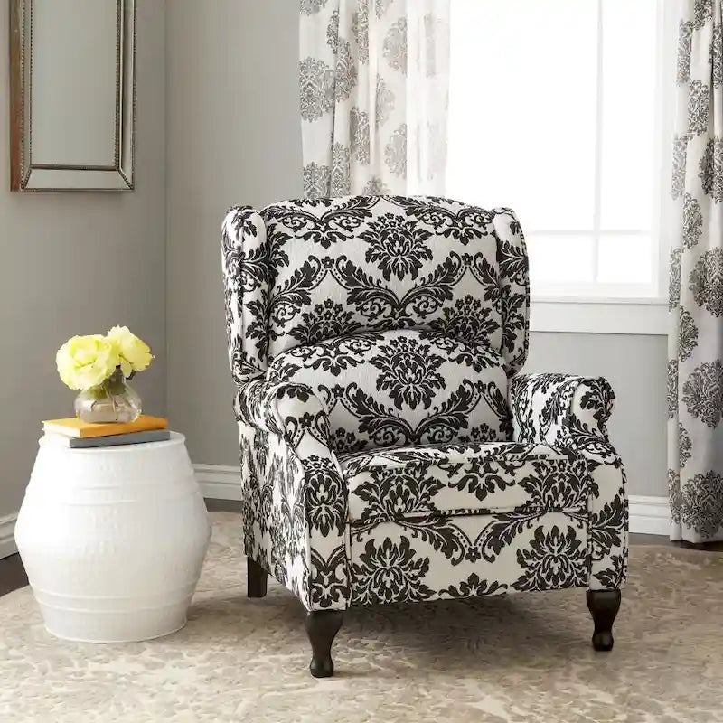 Poltrona reclinabile a spinta con schienale ad ali imbottita e borchie decorative
